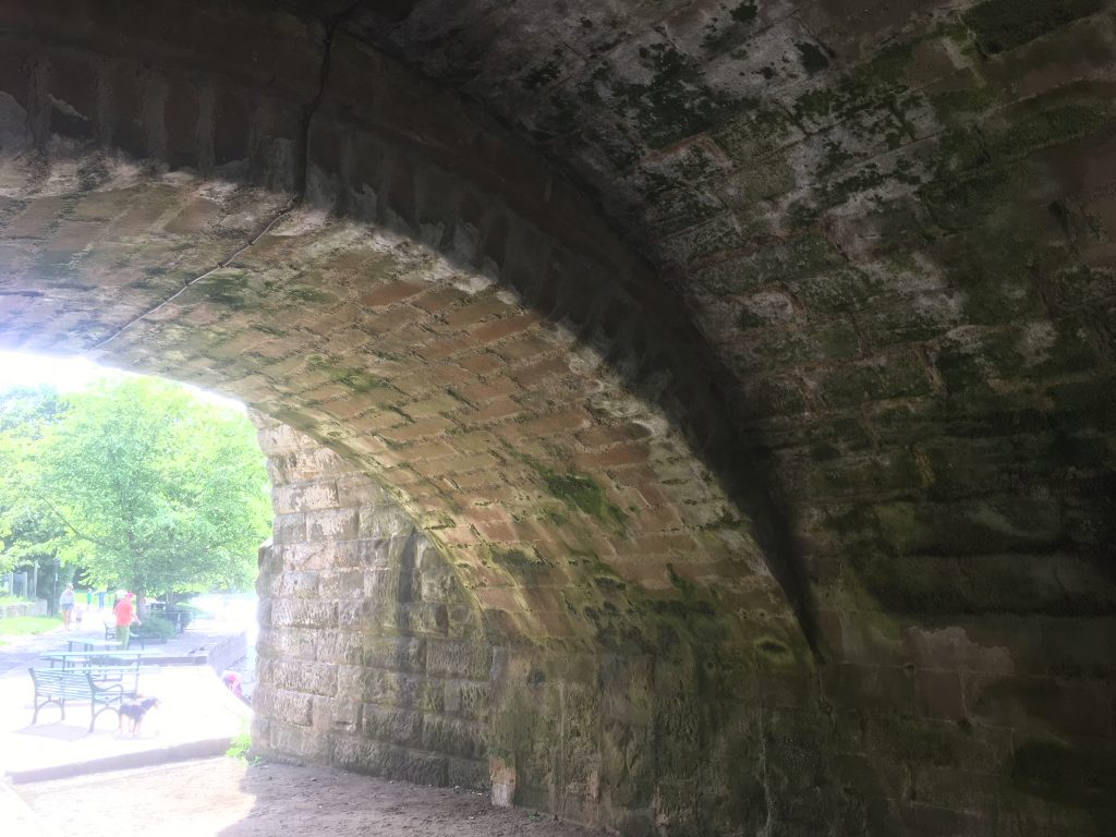 Present day view under Wetherby Bridge showing the original bridge arch in centre and later additions either side.